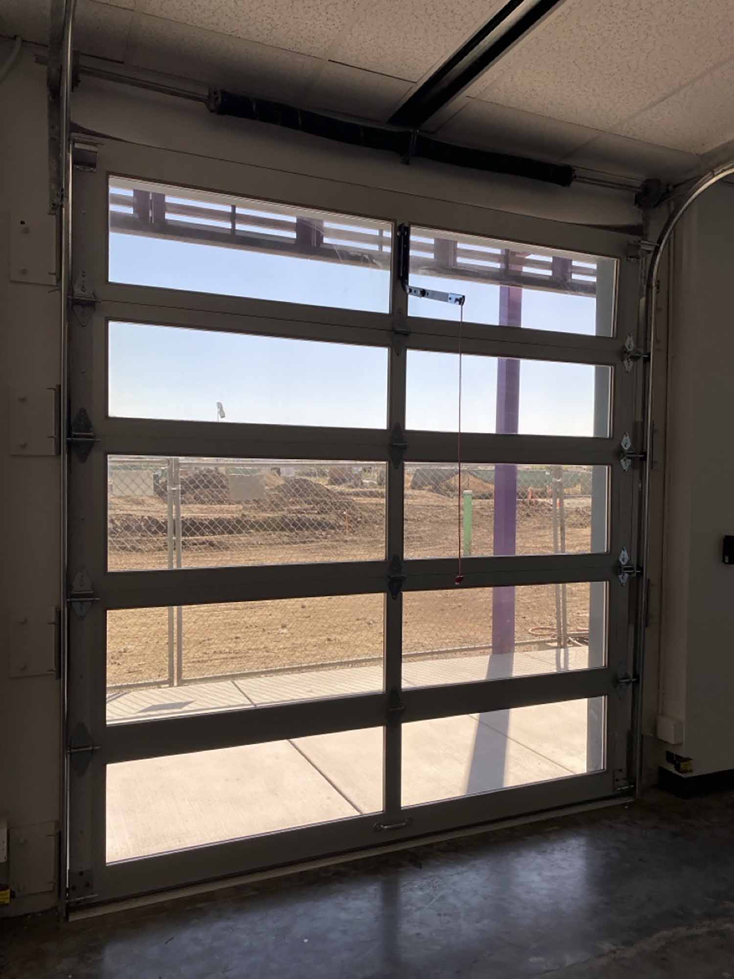 Another interior view of a Hayward school rol up door featuring 3M Night Vision tinted windows.