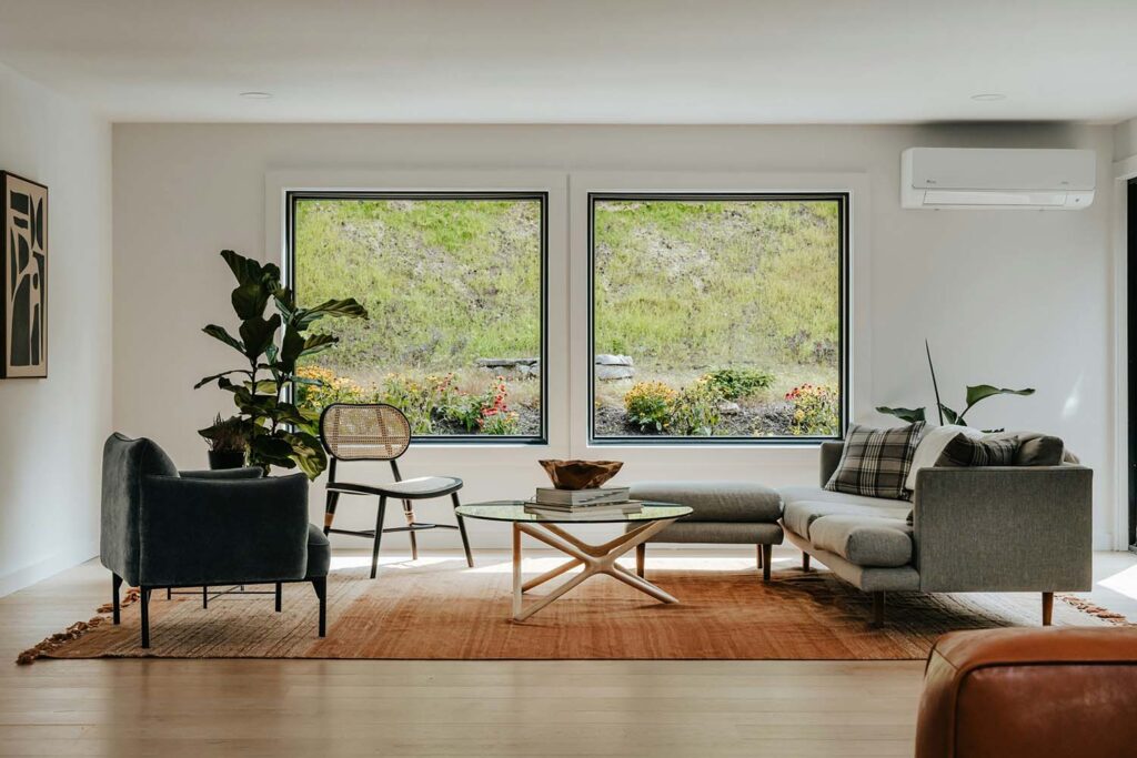 A living room with big windows looks great, but also allows UV rays to stream into your home. Fix that with 3M window film.