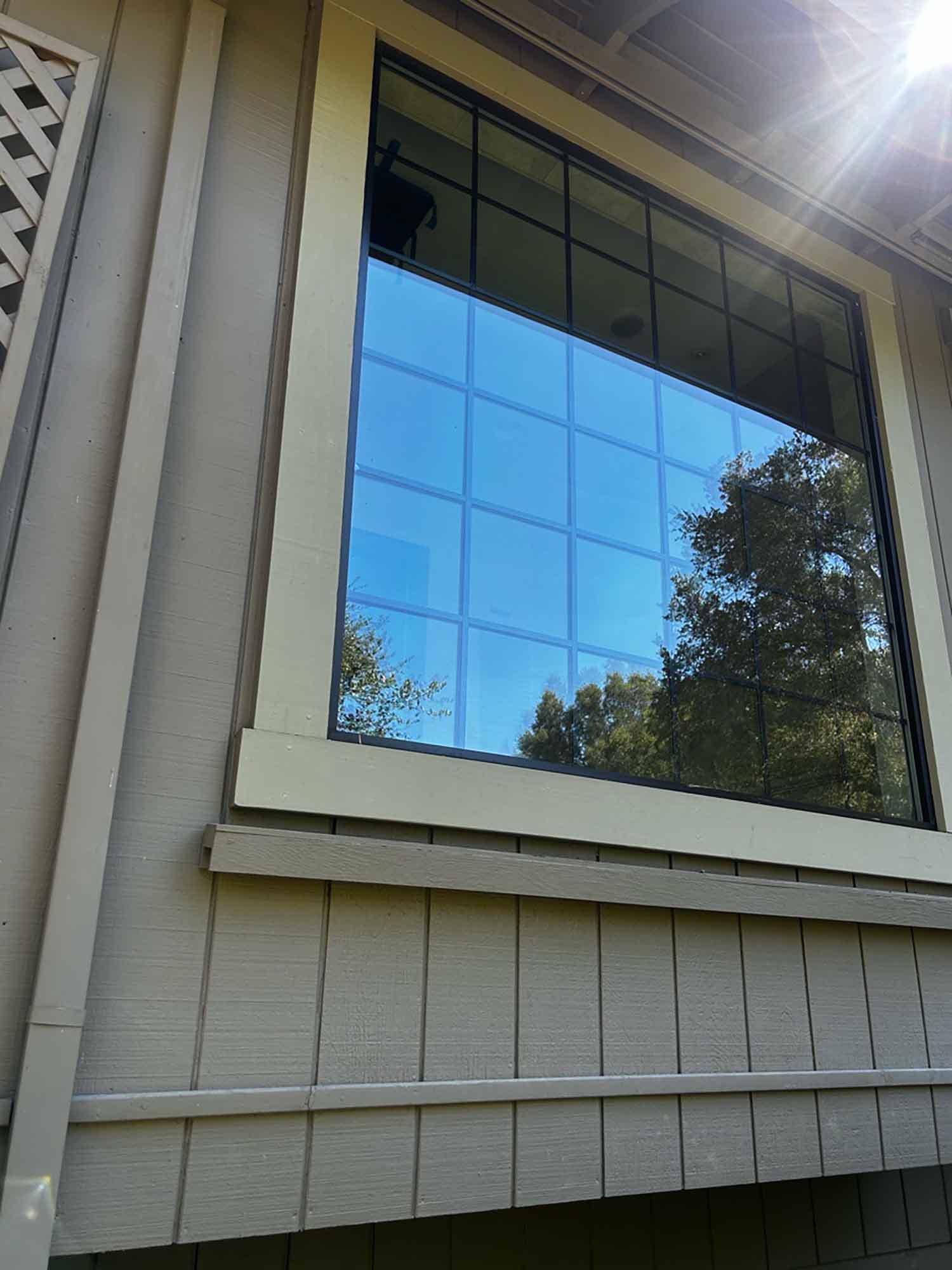 Professional installation of 3M Exterior Window Film on a Santa Rosa home window, applied outside for minimal disruption.