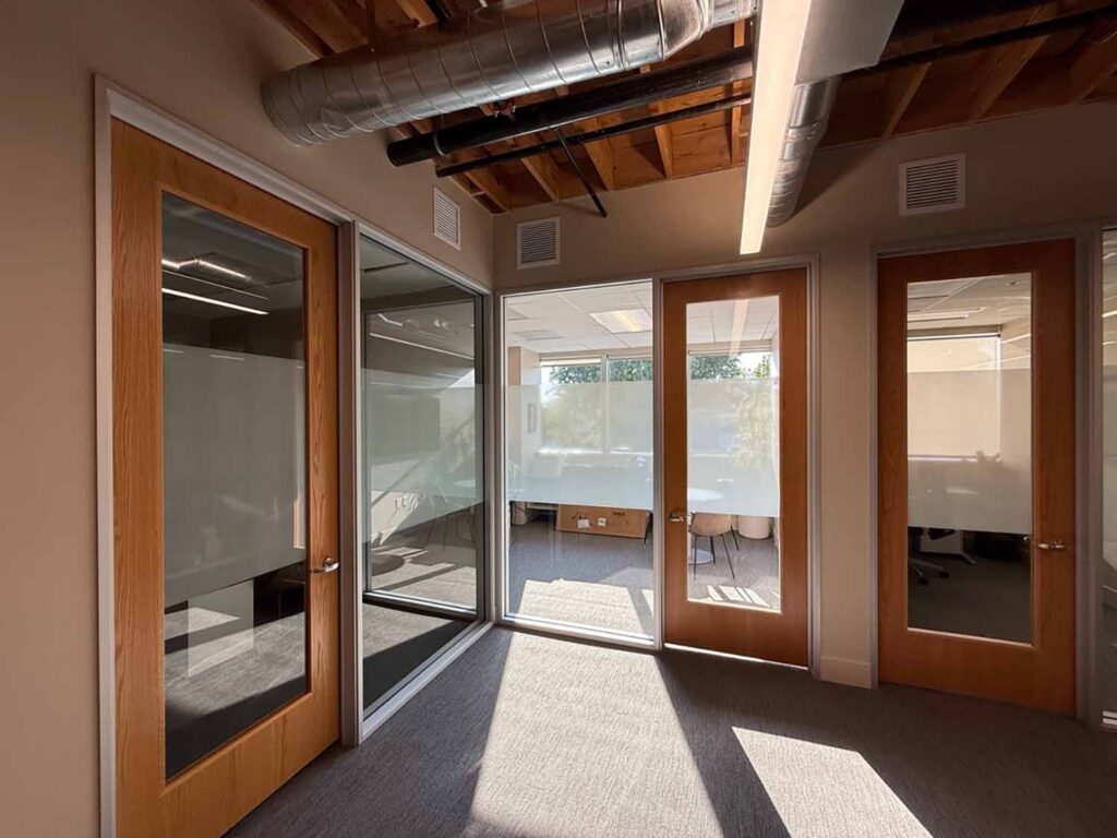 Doors and windows in a Menlo Park office, recently upgraded with custom frosted window film from ClimatePro.