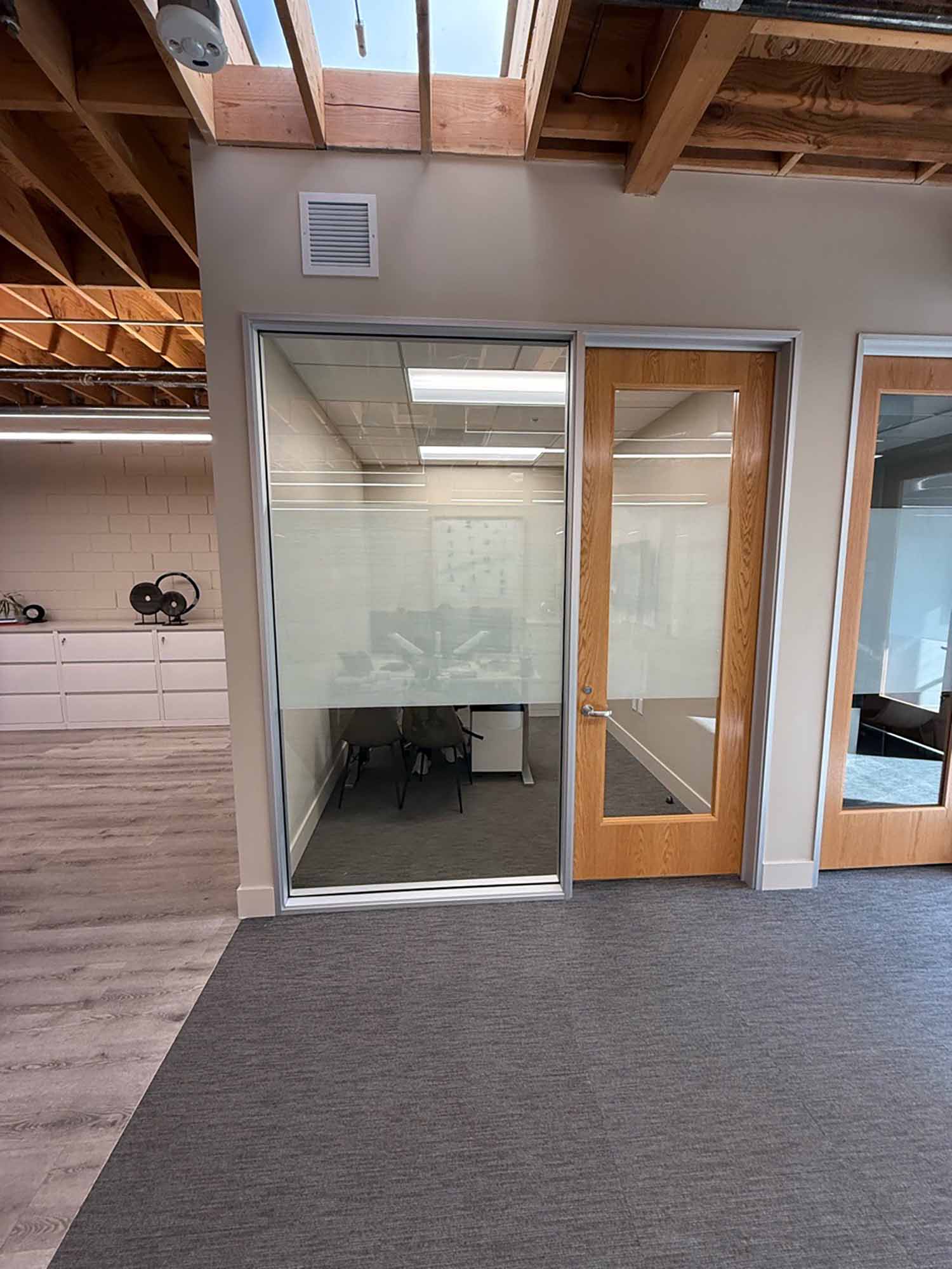 Custom frosted window film gives you just enough privacy without obscuring the light.
