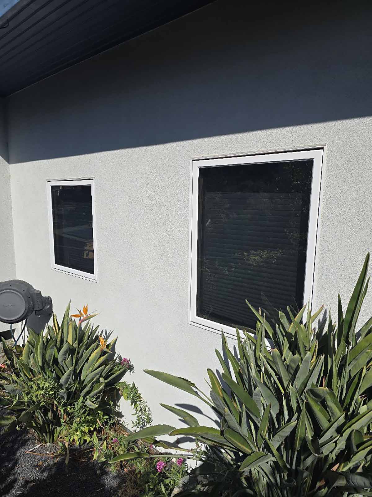 A large living-area window treated with solar-control film helps reduce heat and glare from direct sunlight.