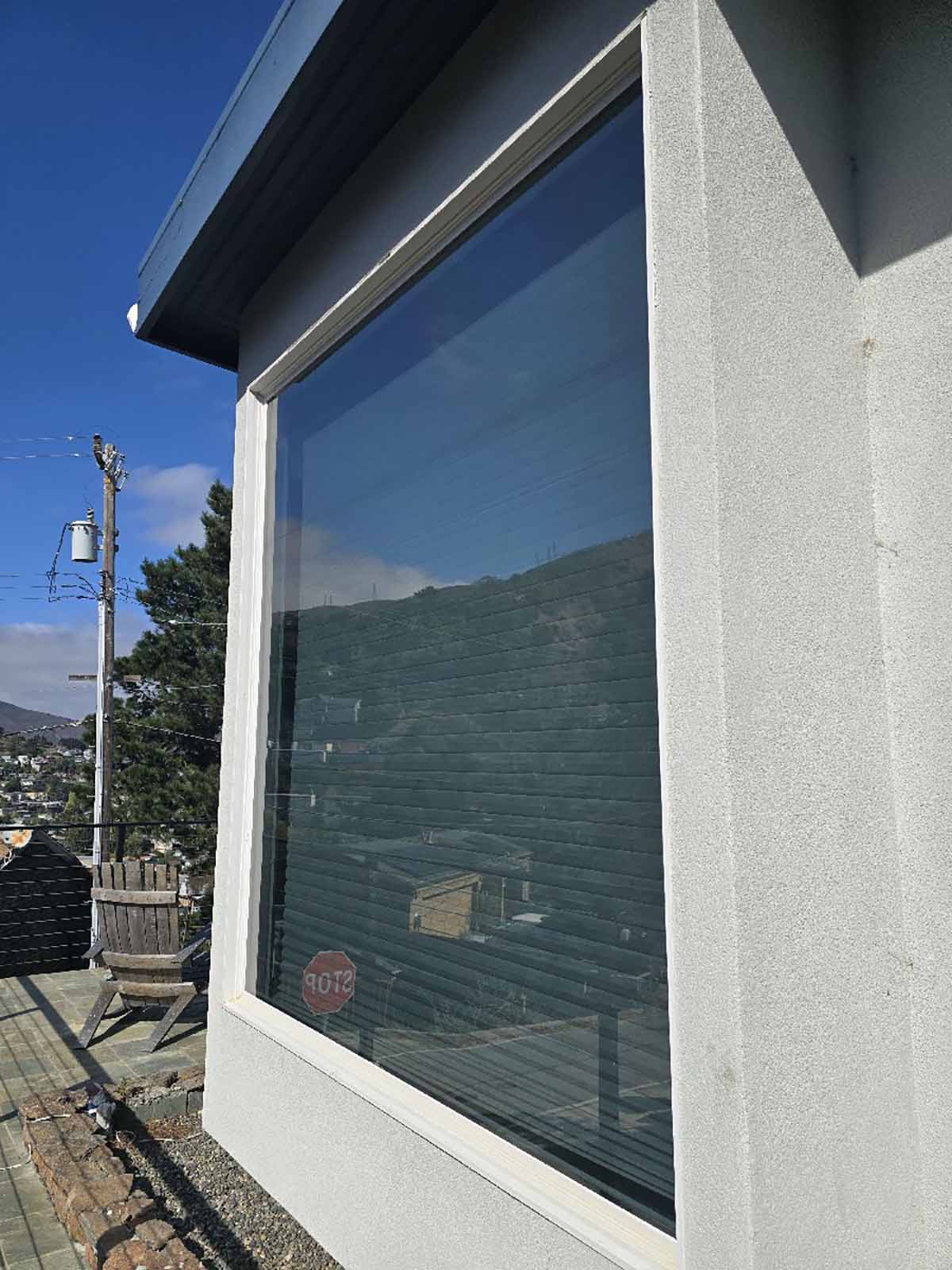 Exterior window film provides solar and UV protection on this Brisbane home's large, sun-exposed windows.